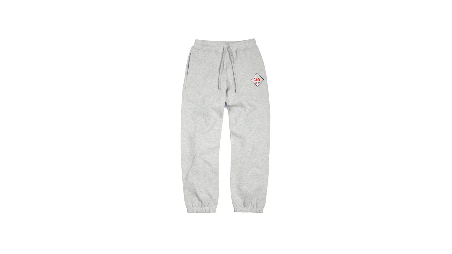 Grey "CHI IS MY TRAP" embroidered jogger pants featuring the "Chi is My 
Trap Sun–Sat" slogan stitched down the leg. Premium streetwear inspired by Chicago grind culture and everyday hustle.